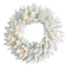 a white christmas wreath with lights on it