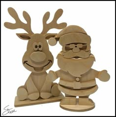 two wooden reindeer figurines sitting next to each other on top of a white background