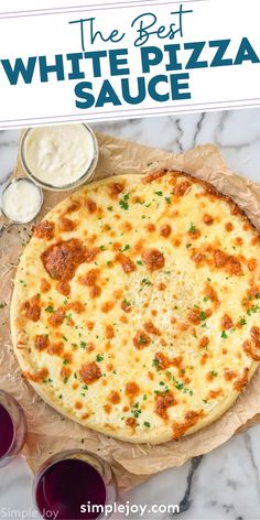 the best white pizza sauce is on top of a paper towel next to some glasses