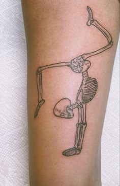 a person with a skeleton tattoo on their leg