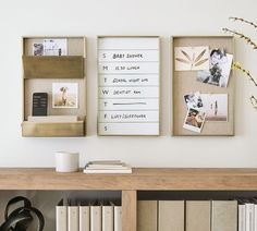 two framed photographs on a wall above a bookshelf with pictures and other items