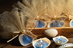 some seashells and candles on a table