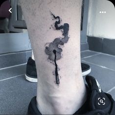 a black ink splattered on the leg of a person