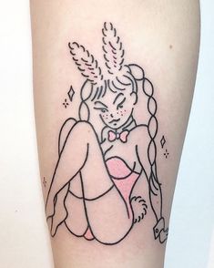 a woman's leg with a tattoo on it that has an image of a mermaid