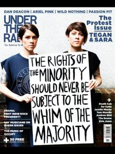 two people holding a sign that says the rights of the minority should never be subject to the win of the majority