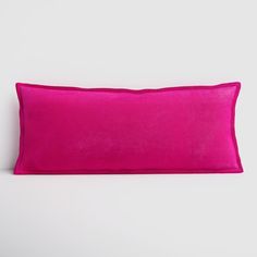 a bright pink pillow on a white background