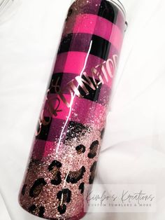 a pink and black can with leopard print on it