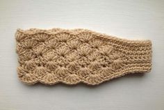 a crocheted headband on a white surface