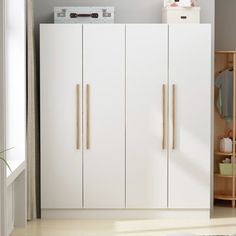 a white cabinet with some wooden handles in a room