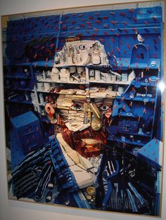 a painting of a man's face made out of objects