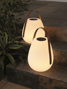 What makes a cozy evening on the terrace even better? the lantern changes immersing the balcony or terrace in a magical ambience. You can hang it on branches using the pretty faux leather handle or simply carry it wherever you need it.  
 The beehive silhouette of these portable solar-powered outdoor lanterns is made of frosted white, outdoor-safe plastic lit by warm white LED lights. This lightweight lantern glows brightly for up to 10 hours on a full battery and includes a USB adapter for endl Beehive Silhouette, Battery Powered Outdoor Lights, Best Outdoor Solar Lights, Battery Powered Lights, Modern Lantern, Solar Lanterns Outdoor, Garden Pathways, Lantern Outdoor, Portable Solar Power