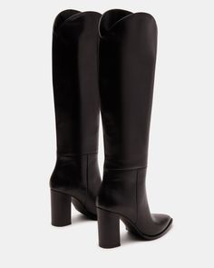 A pointed toe and curved topline give the BIXBY block heel knee boot a Western edge while the sleek upper highlights the clean monochrome look Point toe block heel knee boot Slip-on style Curved topline 3.5 inch heel height Size 6 measurements: 15.5 inch shaft circumference, 14.25 inch shaft height Size 8 measurements: 16 inch shaft circumference, 15 inch shaft height Size 10 measurements: 17 inch shaft circumference, 15.5 inch shaft height Leather upper material Synthetic and textile lining Syn Black Leather Knee High Boots, Black Knee High Boots, Skiing Outfit, Knee Boot, Pink Party, Black Knees, Knee High Leather Boots, Shoes Woman, 5 Inch Heels