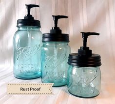 three mason jars with soap dispensers on them