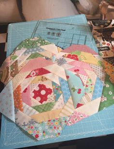 a close up of many different types of quilts on a table