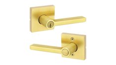 two golden door handles on a white background