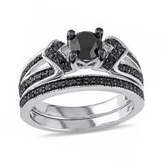 Take her breath away with the dramatic style of this diamond bridal set. Crafted in sterling silver, the engagement ring features an alluring 3/4 ct. black diamond center stone flanked by chevron-shaped collars of black diamonds. Additional black diamonds line the ring's split shank, and intricate milgrain detailing lends vintage appeal to the design. On your wedding day, the black diamond-lined and milgrain-detailed band completes this distinctive look. Captivating with 1-1/8 cts. t.w. of diamo Black Diamond Ring Set, Stylish Engagement Rings, Big Wedding Rings, White Diamond Rings Engagement, Diamond Bridal Ring Sets, Dramatic Style, Black Diamond Engagement, Split Shank Ring, Black Diamond Ring Engagement