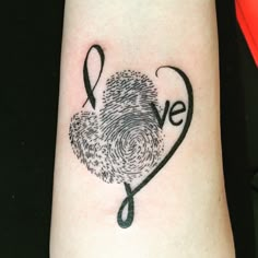 a heart shaped fingerprint with the word love written on it and a ribbon in the shape of a heart