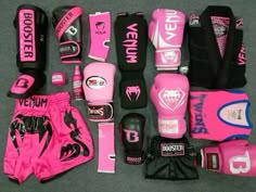 a collection of pink and black boxing gear