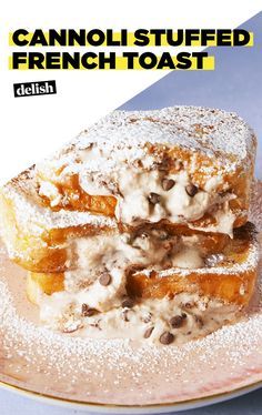 two pieces of french toast stacked on top of each other with chocolate chips and powdered sugar