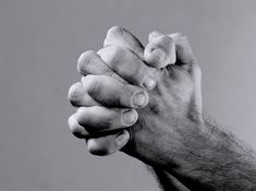 two hands holding each other in black and white royalty images for sale, this is an image of two hands holding each other in black and white stock photography