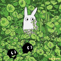 an image of two rabbits in the grass with clovers around them and one rabbit is looking at another bunny