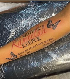 a woman with a tattoo on her arm that says, my mother's keeper because of her i will not fail