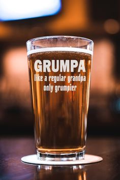 a close up of a glass of beer on a table