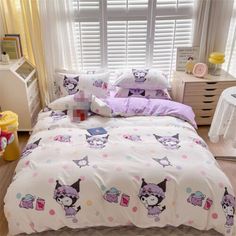 a bed room with a neatly made bed next to a window covered in pink and white sheets