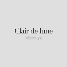 the words clair de lune moonlight are in black and white on a gray background