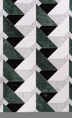 an image of marble tiles with green and white designs on it's sides, as well as black and white stripes