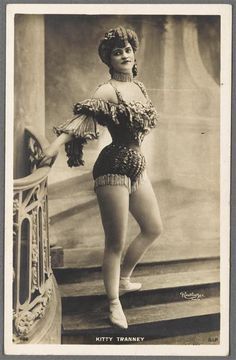 an old fashion photo of a woman in flappers and garb standing on steps