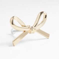 a gold ring with a bow on it