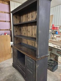 an old wooden bookcase in a garage