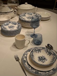 the table is set with blue and white china