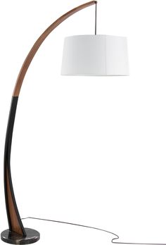 a floor lamp with a white shade on it and a wooden pole in the middle