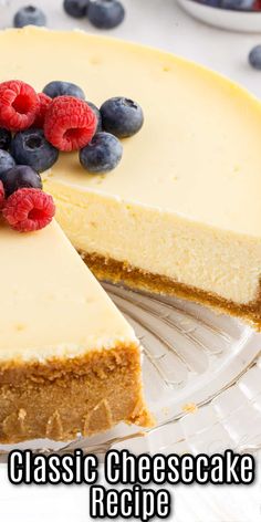 a cheesecake with berries on top and the words classic cheesecake recipe