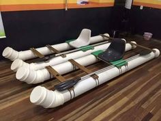 some white pipes sitting on top of a wooden floor