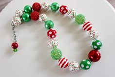 "A festive Christmas palette of red and green, along with my special Christmas sprinkles beads is the perfect thing for Christmas baking. Makes a great stocking stuffer or Christmas present. A matching necklace with a rhinestone Gingerbread Man is also available! Check my Christmas section to find that listing. Visit my Christmas section for more festive necklaces: https://www.etsy.com/shop/ChunkyStuffByLBB?section_id=16141299&ref=shopsection_leftnav_5 ✔ All necklaces come with a 2\" extende Christmas Palette, Chunky Bead Necklace, Festival Necklace, Christmas Sprinkles, Chunky Bead Necklaces, Chunky Bracelet, Necklace Chunky, Bubblegum Beads, Chunky Bracelets