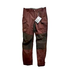 a pair of red pants with black and brown trims on the bottom, side view