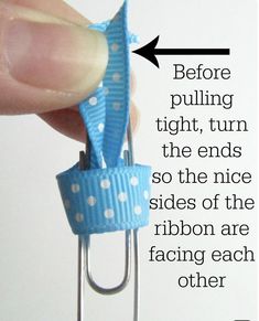 a person is holding a blue ribbon on a metal clip with the words before pulling tight, turn the ends so the nice sides of the ribbon are ribbon are facing each other