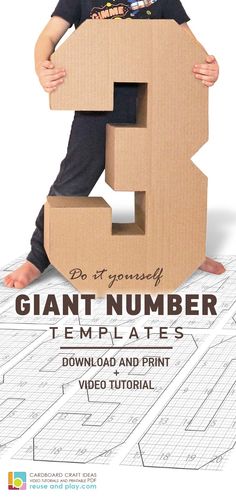 a young boy holding a cardboard letter that says giant number 3 templates for video and print