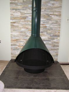 a large black stove sitting inside of a room