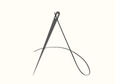 a black and white drawing of a pair of scissors with the letter a on it