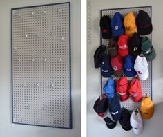 there are many hats on the pegboard and one is hanging up against the wall