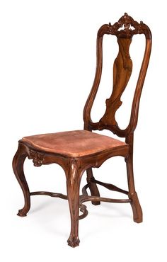 an antique wooden chair with leather seat