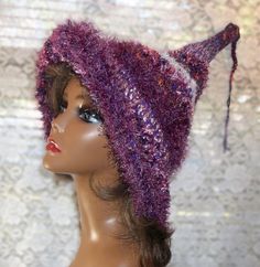 Beautiful shades of purple crochet witch/wizard costume hat.  Great for Halloween parties, cosplay events, trick or treating or just for fun.  Makes a nice gift for a witchy friend. Created with a mixture of purple and pink acrylic yarns, eyelash yarn and specialty yarns. Hand wash with a mild detergent and lay flat to dry. 18" brim to tip fits most adults or teens Witchy Winter Hats For Party, Halloween Cosplay Beanie Hat, Fitted Costume Hats And Headpieces For Winter Festival, Adjustable Purple Hat For Costume, Purple Whimsical Winter Hat, Whimsical Purple Winter Hat, Purple Winter Festival Hat, Purple Festival Winter Hat, Adjustable Purple Crochet Hat For Winter