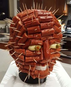 a fake head made out of hot dogs