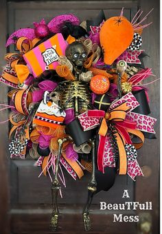 a halloween wreath with skeletons and decorations