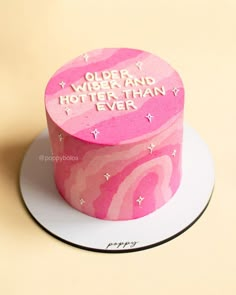 a pink and white cake with writing on the top that says, order work and get better than i ever