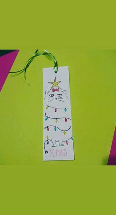 a tag with an image of a cat wearing a party hat and lights on it